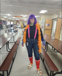 Dr. Chapman dressed up for Homecoming in different colors