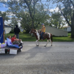 Daniel riding horse in parade