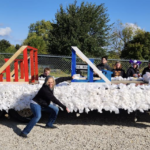 Jennifer pointing out junior float